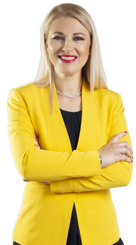Dr. med. Zorana Pravdić im gelben Blazer, lächelnd mit verschränkten Armen
